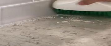 How To Install And Replace Caulk On A Kitchen Tile Backsplash & Countertop 